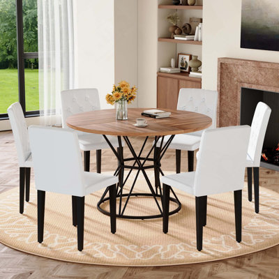 7PCS Table And Chair Set. Circular MDF Dining Table With Hourglass Shaped Metal Base Paired With 6 Ergonomic Buckle Backrest Dining Chairs