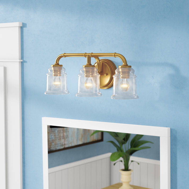 Akini 3-Light 22 inch Wide Natural Brass Gold Industrial Bathroom Vanity Lighting Fixture, Clear Glass Shade, Dimmable, LED Compatible, Over the Mirror Mounted Steel Wall Sconce
