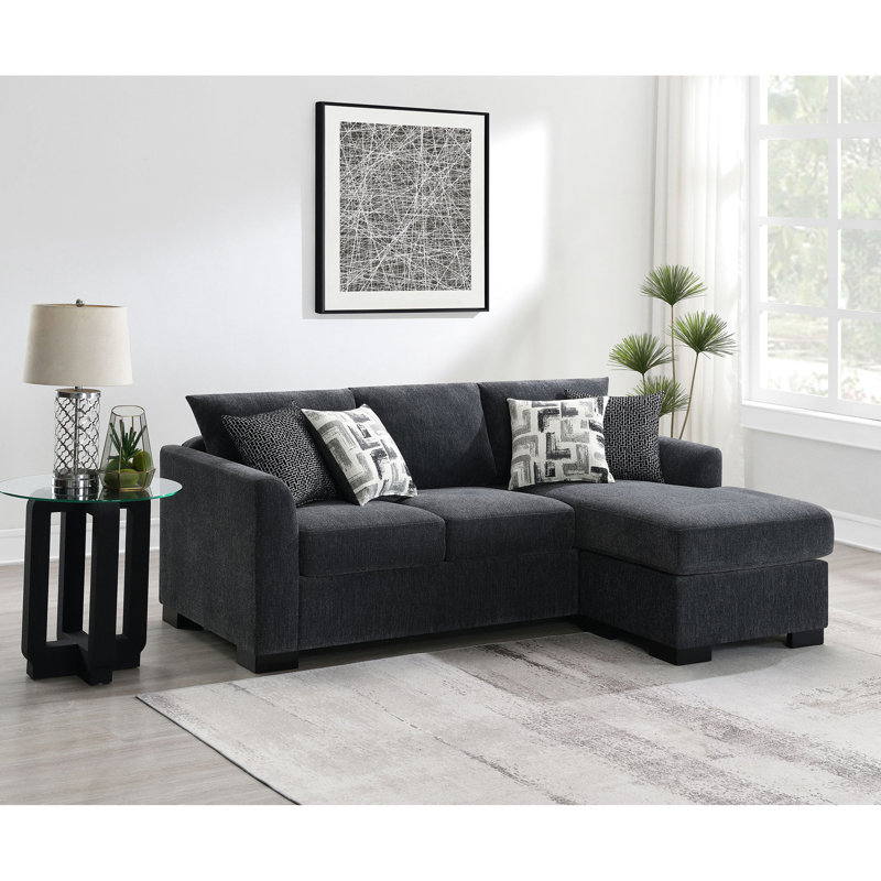 Canapé d'angle convertible gris foncé avec accoudoirs arrondis, siège à ressorts ensachés et quatre coussins décoratifs contemporains - Configuration