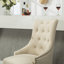 Ensemble de deux fauteuils à oreilles capitonnés en bois massif brun clair avec têtes de clous, pour un siège confortable et élégant-981012996