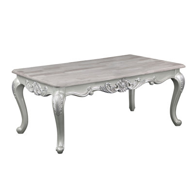 Table basse de style traditionnel Melrose avec finition argentée, parfaite pour les espaces de vie élégants et fonctionnels.