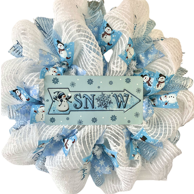 Couronne de neige d'hiver avec bonhomme de neige