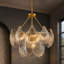 Lustre en verre doré 9 lumières Claridge avec panneaux en verre transparent texturé et chaîne réglable