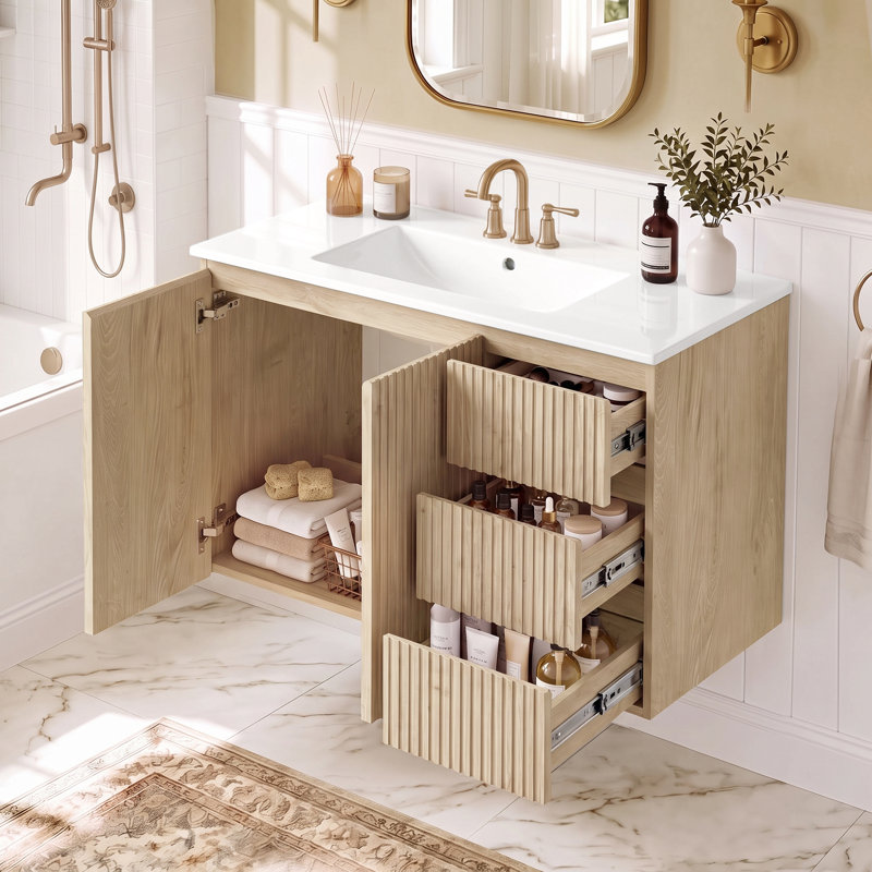 Meuble-lavabo mural de 91 cm (36 pouces) avec lavabo en céramique, 3 tiroirs à fermeture amortie, portes à fermeture amortie et poignées dissimulées.