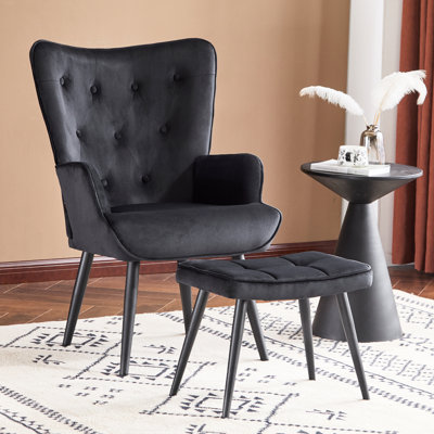 Fauteuil à oreilles et repose-pieds capitonnés