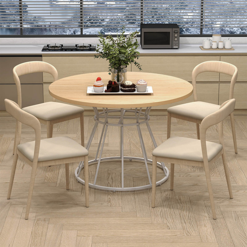 Table de salle à manger ronde de 119 cm (47 po) avec dessus en bois et piètement en métal, finition naturelle et blanche.