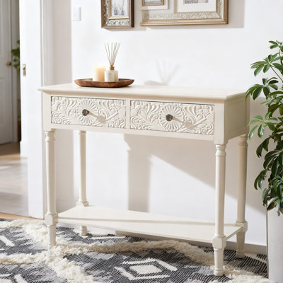 Console 2 tiroirs blanc vieilli pour le vestibule et le salon, style campagne avec tiroirs floraux sculptés