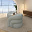 Fauteuil demi-tonneau rembourré et pivotant-583774003