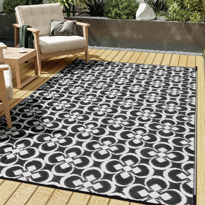 Tapis extérieur géométrique à motif floral