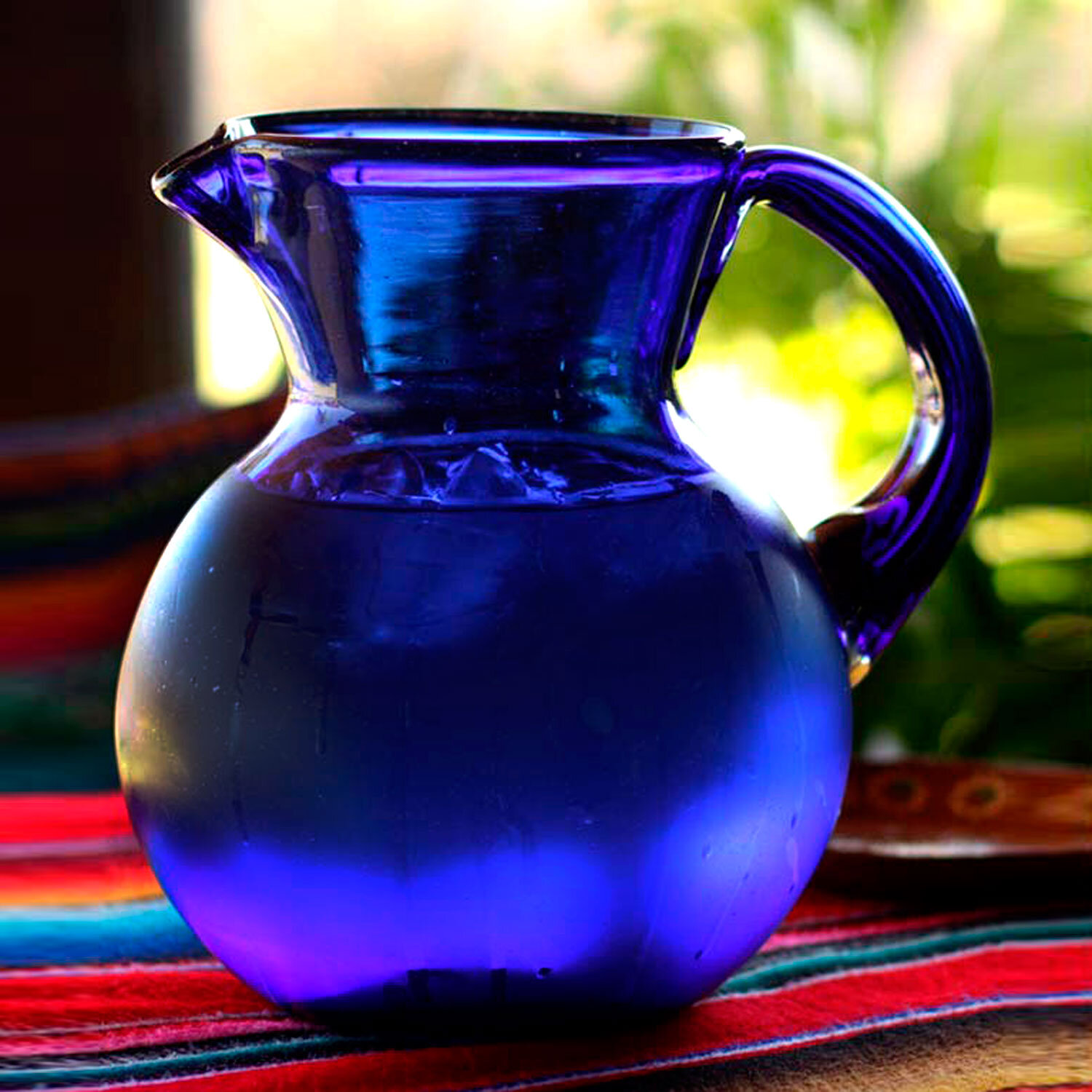 https://assets.wfcdn.com/im/07254663/compr-r85/3421/34214034/rabito-classic-recycled-glass-98-oz-pitcher.jpg