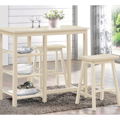 Configuration de salle à manger à 3 comptoirs. Table avec 3 tablettes ouvertes. Tabourets de selle pour la détente. Pieds en bois. Convient aux petites zones colorées. Structure de rangement en bois. Convient aux espaces compacts