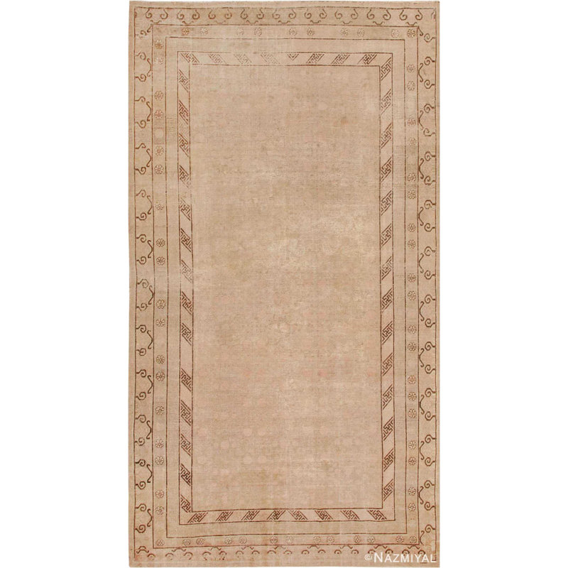 Tapis Khotan antique doux et délavé