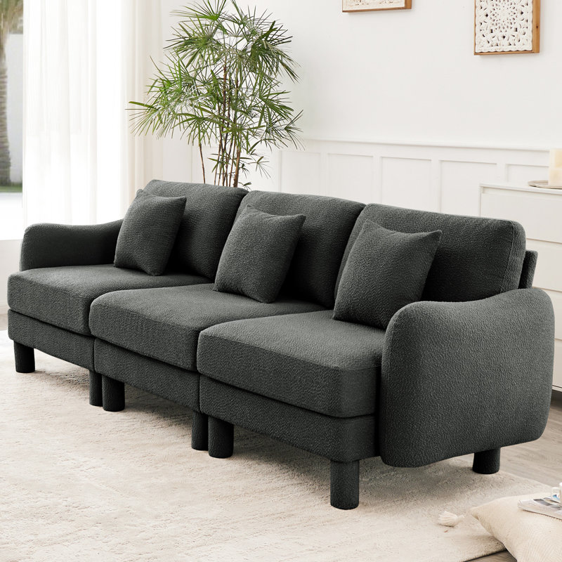 3 canapé en tissu bouclé gris foncé avec des pieds cylindriques en forme de coquille distinctifs, un style moderne pour le bureau à domicile, un support solide en bois, un revêtement doux et confortable, un design élégant et relaxant