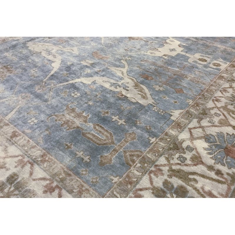 Tapis bleu et ivoire de haute qualité noué à la main