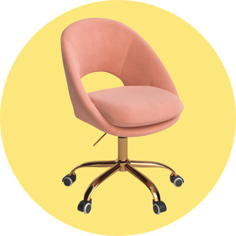 A pink velvet swivel office chair with a cutout back and gold wheeled base, on a circular yellow background.