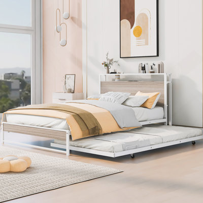 Structure de lit plateforme robuste en métal avec lit gigogne, ports USB, support à lattes et tablettes de tête de lit pour améliorer le confort et la fonctionnalité de la chambre à coucher