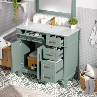 Meuble-lavabo moderne vert clair de 36 po avec lavabo en céramique, porte à fermeture en douceur et 4 tiroirs de rangement, offrant un look raffiné avec une fonctionnalité pratique au quotidien.