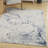 Wrought Studio™ Motion 5'3" x 7' Ivory Blue Modern Indoor Rug
