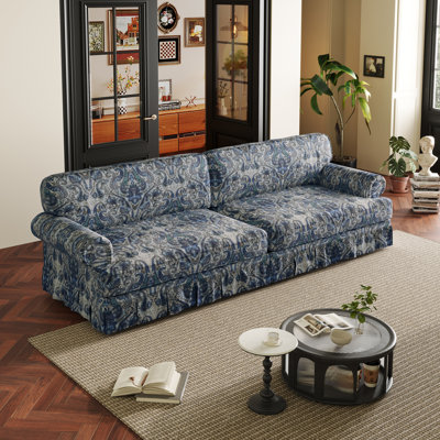 Luxuriously Comfortable 4-Seater Cloud Couch With Extra Deep Seat, Rolled Arms, And Pleated Skirt Design For Modern Living Spaces.