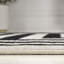 Tapis noir / ivoire Isibeal-336781270