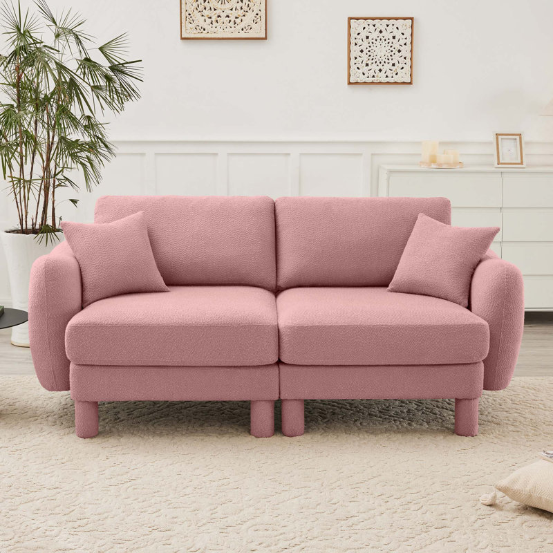 Canapé à 2 places avec accoudoirs en forme de coquille en tissu Boucle pour le confort et la détente d'un salon moderne