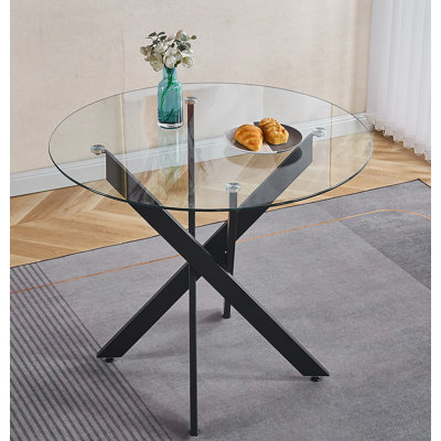 Table de salle à manger noire avec pieds en croix en métal et verre trempé