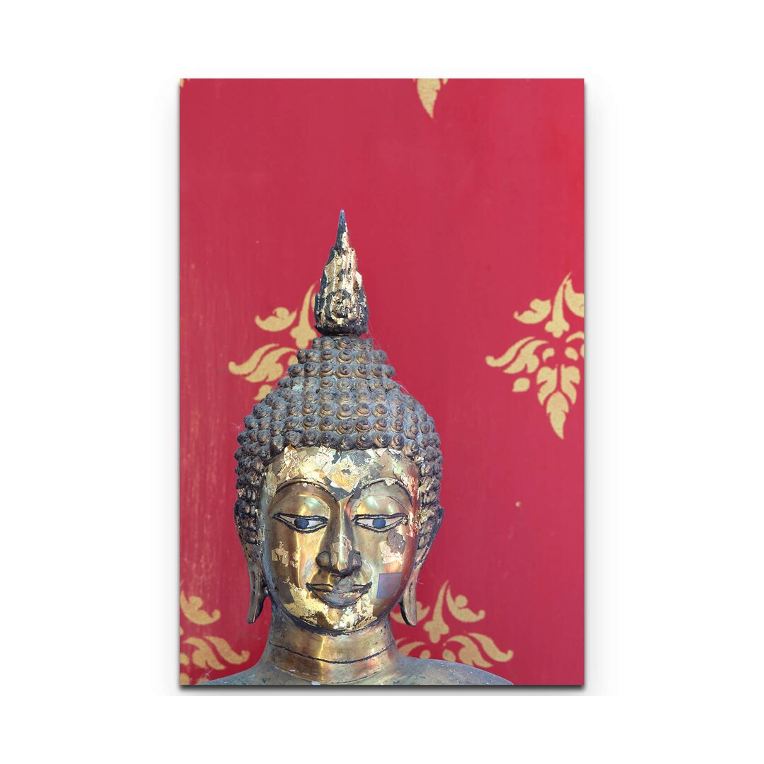 Leinwandbild Kopf einer Buddha Statue vor thailändischer Wandmalerei