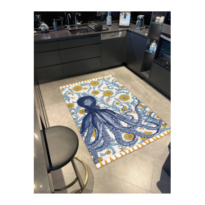 Tapis tissé à motif de pieuvre dans des tons de bleu