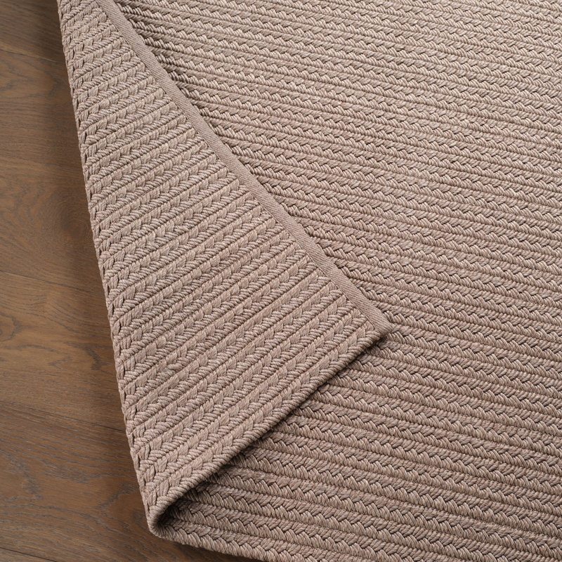Iver Indoor/ Outdoor Solid Tan Area Rug, Rectangle 6' x 9'
