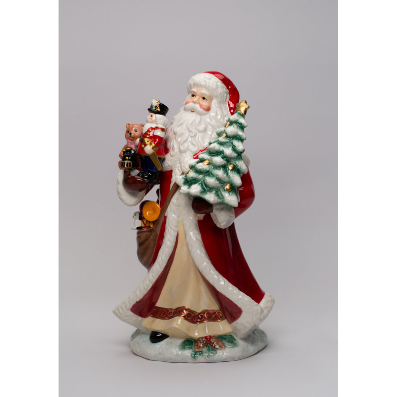 Figurine de père Noël tenant des jouets