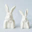 White Rabbit Leaning On Its Paws Figurine