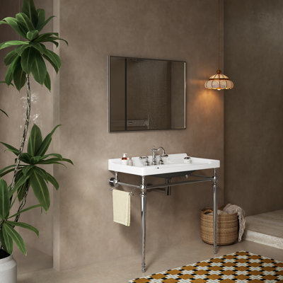 Meuble-lavabo de salle de bain moderne en céramique avec pieds en acier inoxydable et barre à serviettes