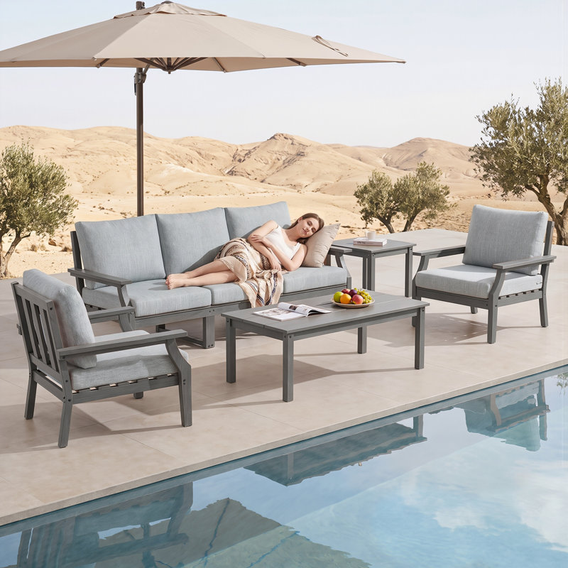 Ensemble de mobilier de jardin 7 pièces en PEHD, comprenant 2 fauteuils, 1 canapé 3 places, 1 table d'appoint et 1 table basse.