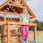 Dolphin Playground Luxury Cedar Playground Set: Double Wave Slide, 2-in-1 Table, Monkey Bars, Balance Beam, 3 Swings, Large Rock Wall, Wood Roof