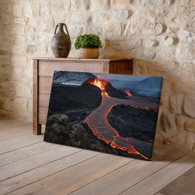 Canvas A Dramatic Volcanic Landscape Showcasing Flowing Lava In Vibrant Shades Wall Art Of Red And Orange Winding Through A Dark Canvas Wall Art