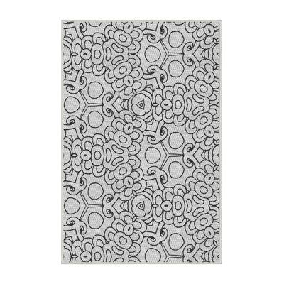 Tapis blanc/noir à motifs
