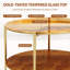 Table basse ronde à deux niveaux avec plateau en verre trempé teinté doré et étagère en bois de noyer, pattes en fer doré pour salon