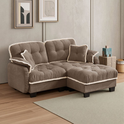 Causeuse avec repose-pieds mobile et quatre coussins