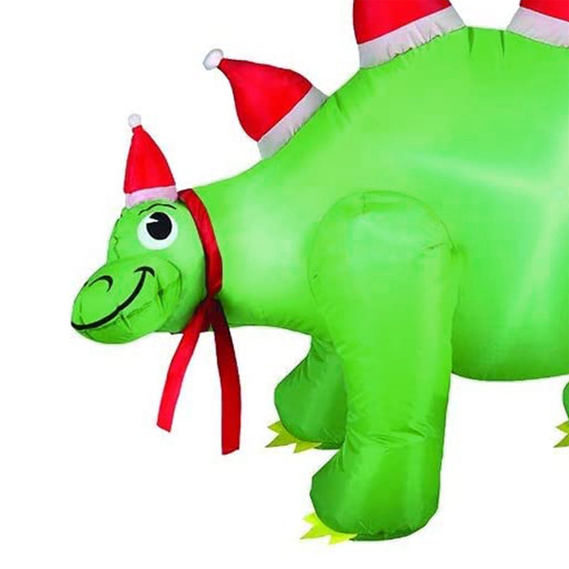 Stégosaure avec chapeaux de père Noël gonflables