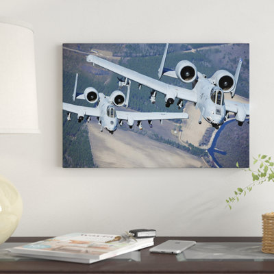 " Two A-10C Thunderbolt II Aircraft Fly In Formation " by Stocktrek Images
