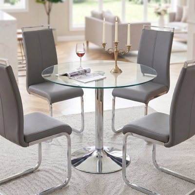 Ensemble de salle à manger 5 pièces rond en verre trempé moderne avec piédestal chromé et chaises en similicuir