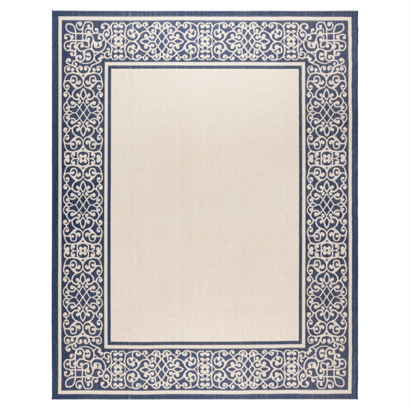 Tapis d'intérieur / extérieur en polypropylène tissé à plat à bordure à volutes crème bleu marine beige Solterra Guilhermino