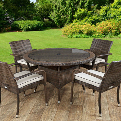 Faulk 4 - Person Patio Dining Set with Round Table , Cushions Included