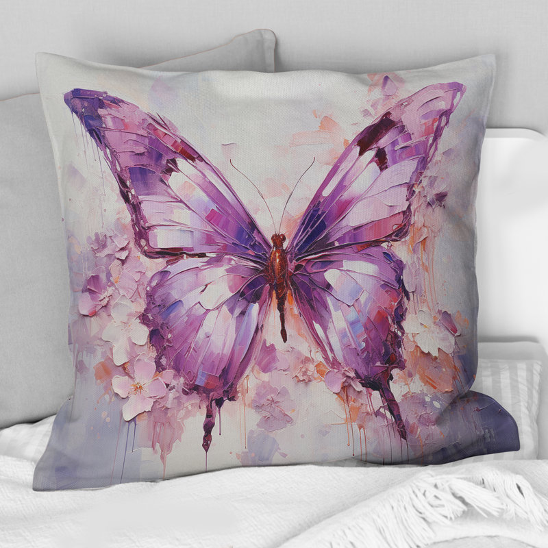 Coussin décoratif mauve à motif papillon violet