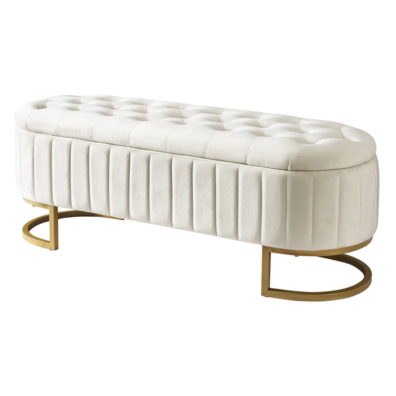 Rangement en velours beige avec boutons capitonnés à l'avant et pieds en métal