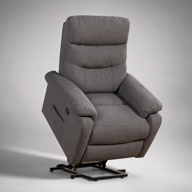 Fauteuil releveur contemporain avec revêtement en tissu gris, fonction de relevage et inclinaison électriques pour un confort et une mobilité optimaux.
