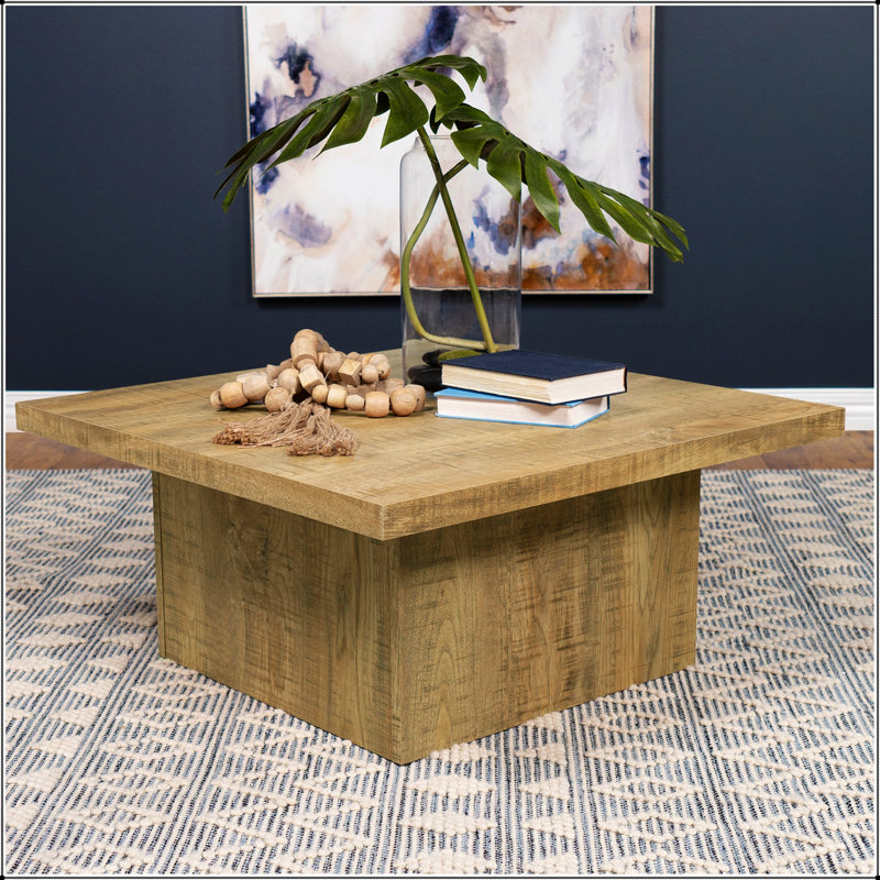 Table basse carrée Exeter Mango avec plateau spacieux et fabrication durable, parfaite pour les intérieurs rustiques et modernes.