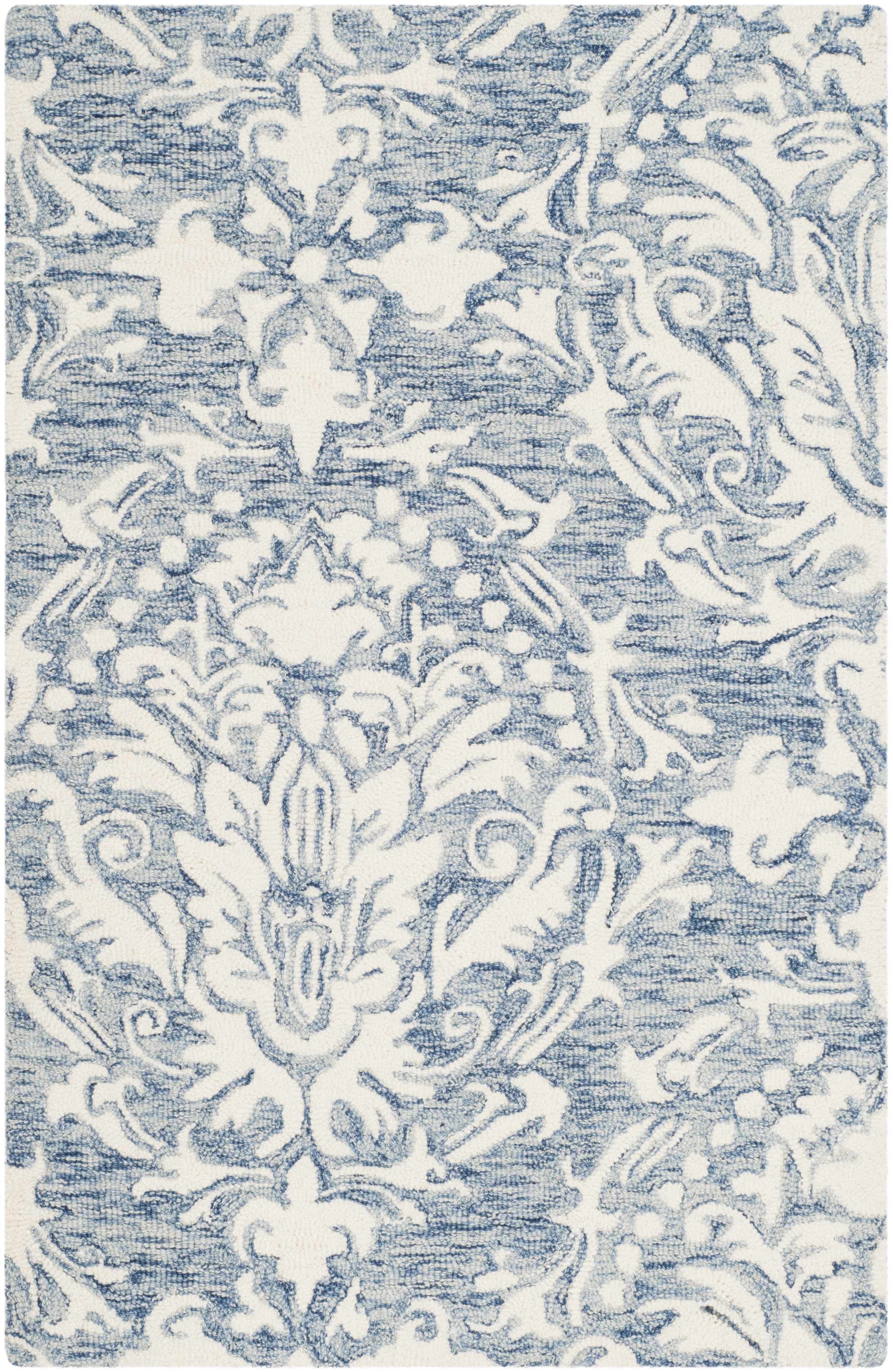 Ferrera Ikat Handmade Tufted Wool Blue / Ivory Area Rug