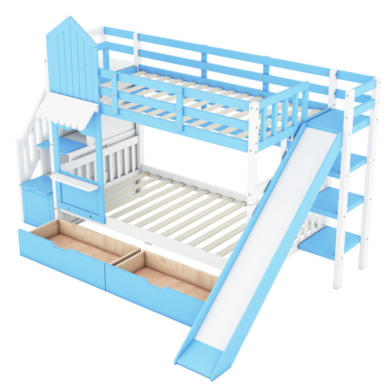 Lit superposé Twintwin avec 2 tiroirs, 3 tablettes et glissière - bleu. Fabrication en bois massif depuis plus de 6 ans. Aucun sommier tapissier requis. 106,3 po x l 76,6 po x H 72,8 po. Capacité de poids de 250 lb par glissoire bleue. 6.