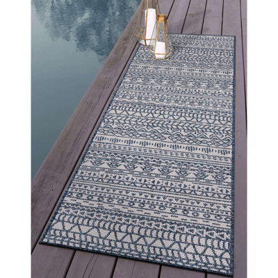 Tapis bleu / crème en polypropylène tissé à la machine Jezeniah Southwestern